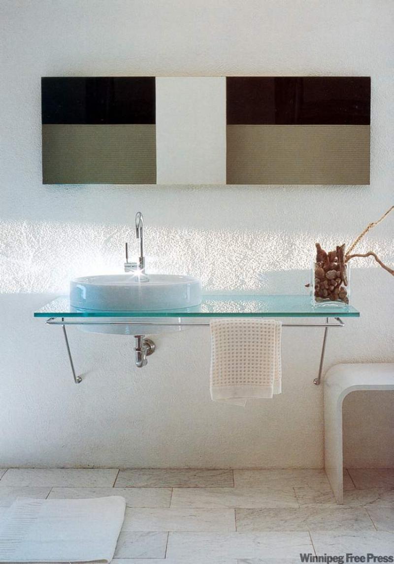 This futuristic-looking sink with glass countertop looks great, but is impractical for a main bathroom. 