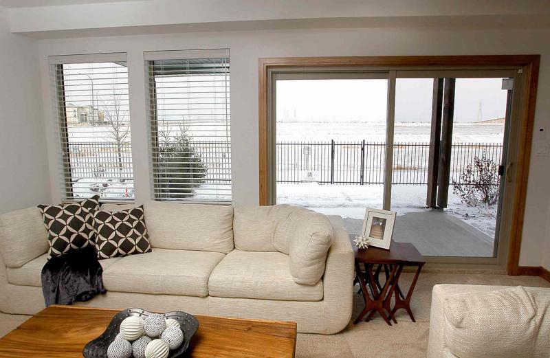 Patio doors on the lower level lead to the back yard.