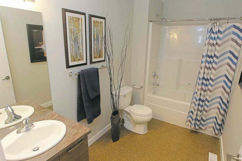The main bathroom has laminate flooring.