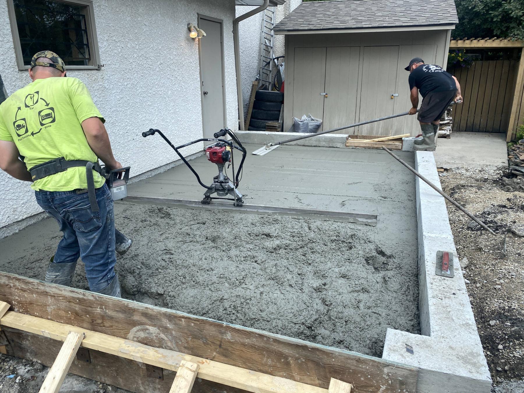  <p>The new concrete footings and pad were poured to serve as the foundation for the garage addition.</p> 