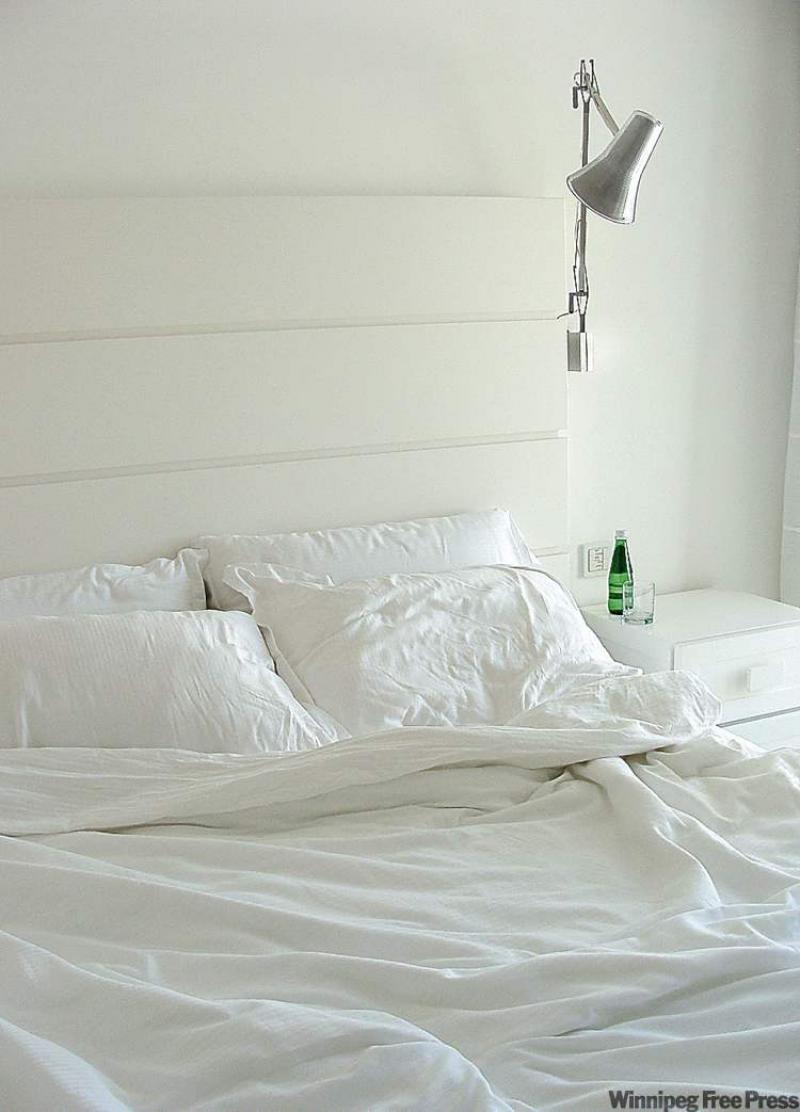 This simple headboard is made from plywood boards with a high-gloss paint finish.
