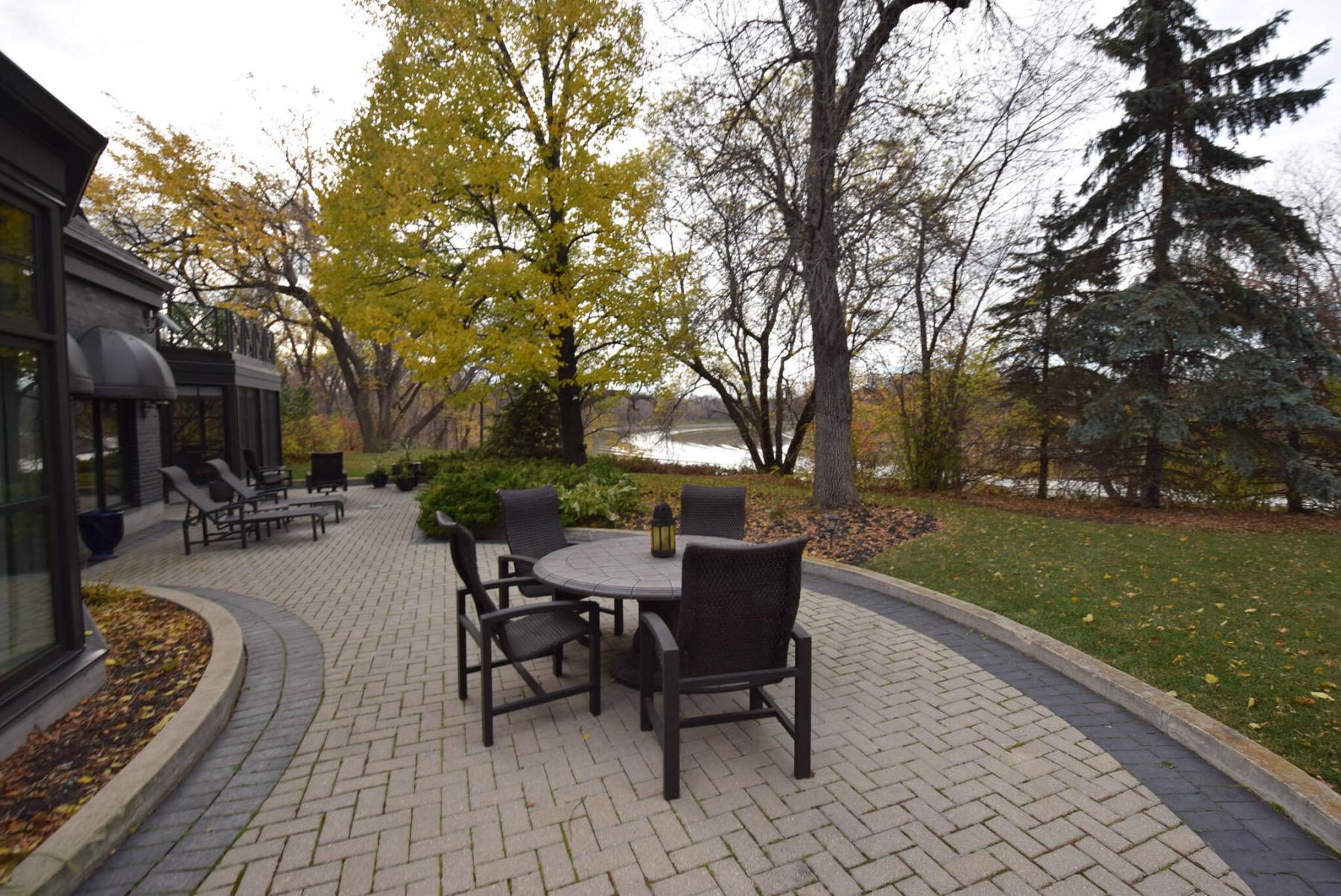  <p>TODD LEWYS / FREE PRESS</p>
                                <p>The river views from the park-like backyard are breathtaking.</p> 