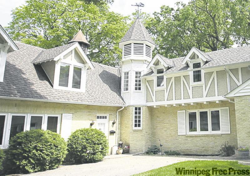 Two wings of the house are connected by a unique cupola, which originally ventilated the stables. 