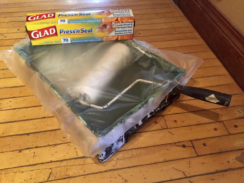 <p>Leftover paint in a paint tray can be salvaged while waiting to start the second coat by using Press'n Seal to halt the drying process. </p>