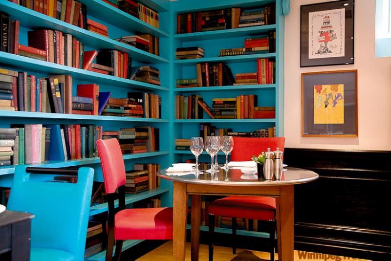 Playful colours mix it up in this enticing library dining setting.