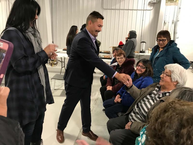 <p>Supplied</p><p>Coun. Chris Traverse hands over keys to a community member moving home to Lake St. Martin First Nation. Seven years ago, a flood forced residents to evacuate.</p>