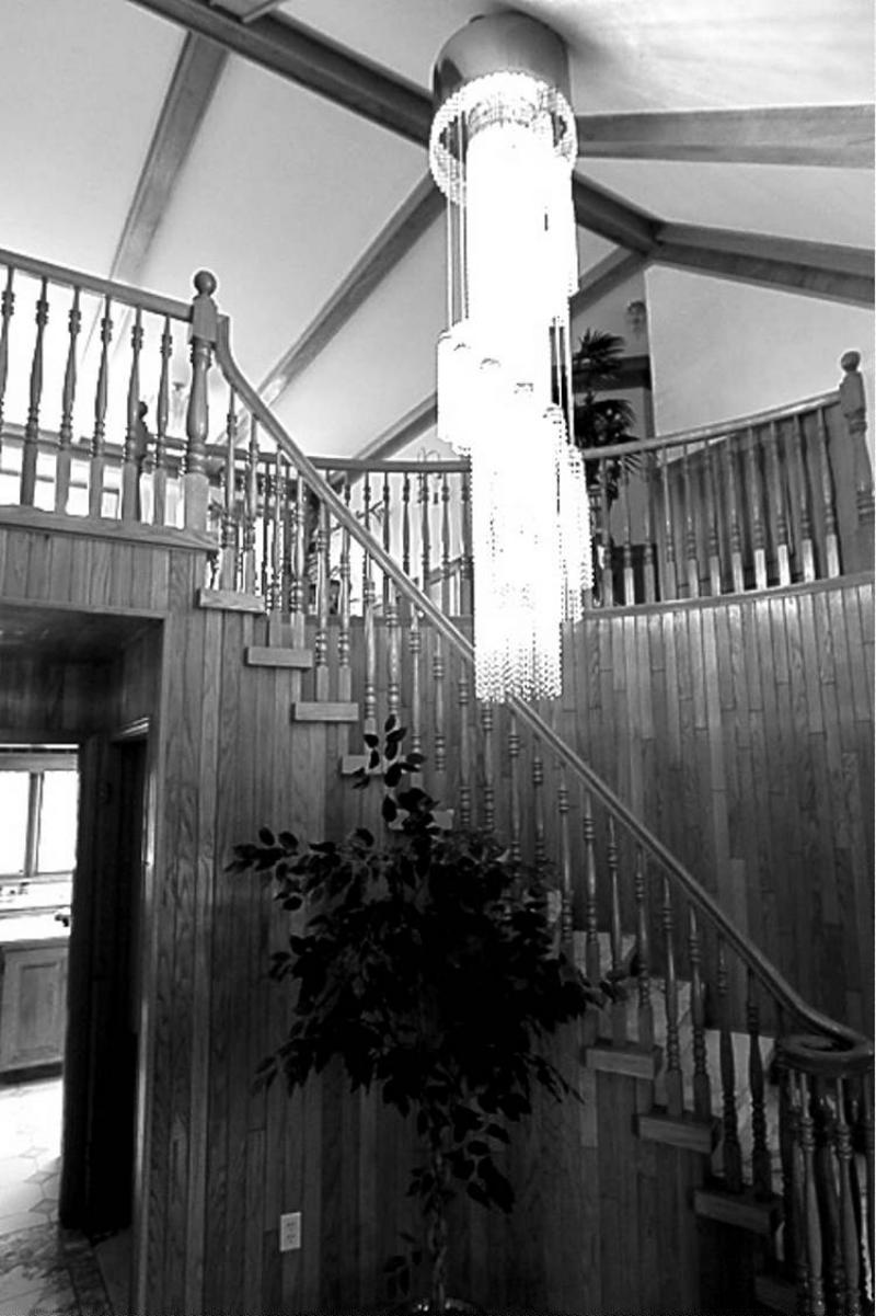 The grand entrance â wide marble foyer, curved oak staircase and glass bead chandelier â is trumped (or at the very least perfectly complemented) by the vista that spreads out beneath the balcony.