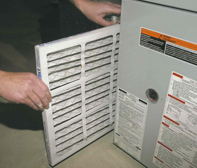 Pulling a furnace filter out of the slot in the return air ducting and replacing it with a new one is a simple task.