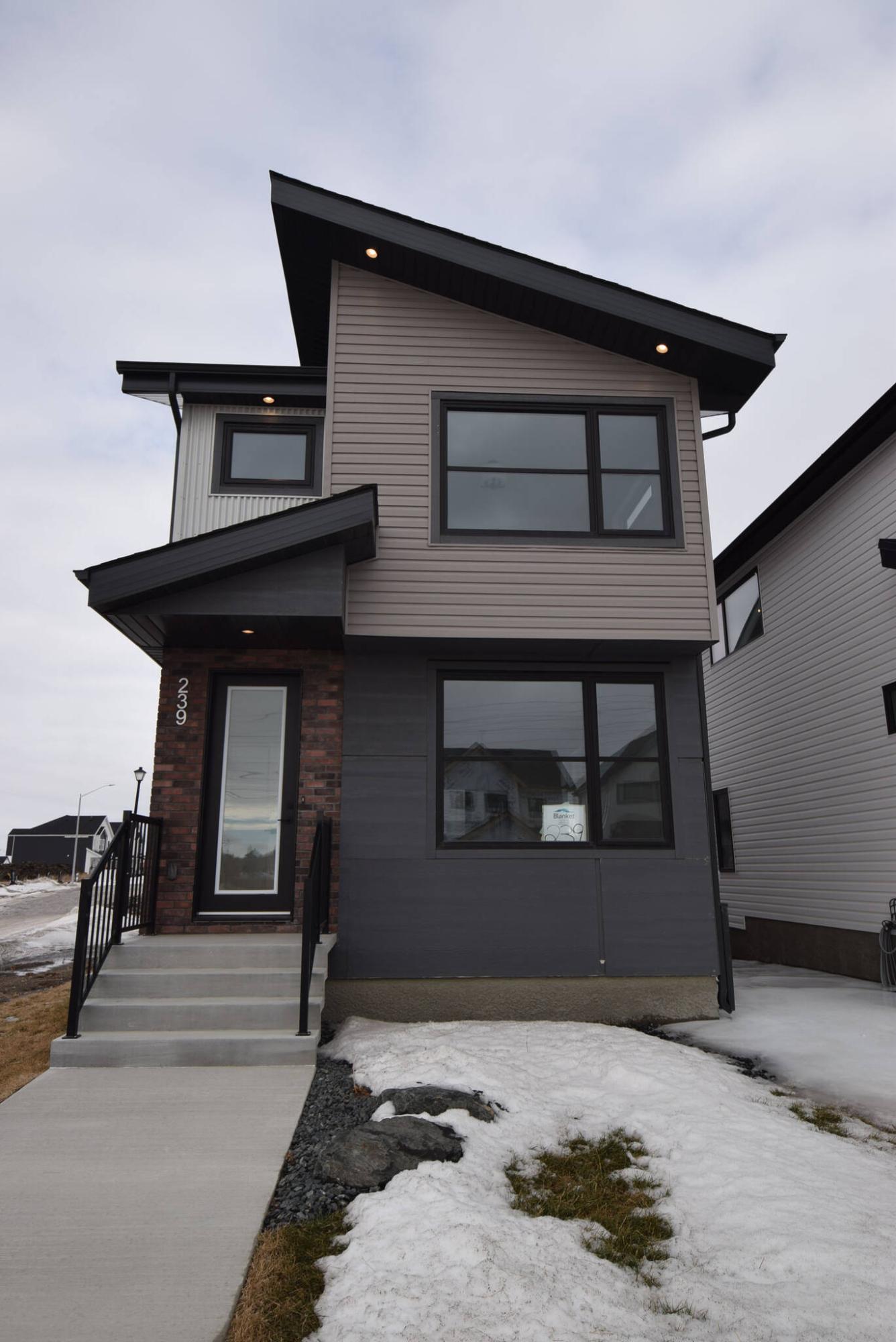  <p>TODD LEWYS / FREE PRESS</p>
                                <p>Sharp-looking outside and efficiently designed inside, the 1,330-sq.-ft., two-storey Avery D-23 model starts at $475,000 with standard finishes.</p> 