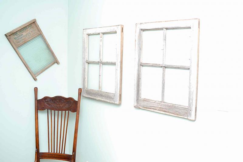Windows from the original barn, an antique chair and a washboard are part of the barn's rustic chic.