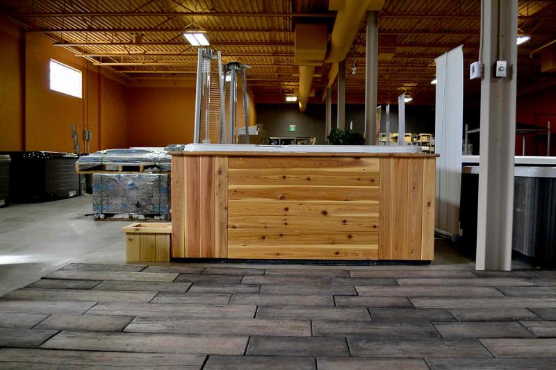 Crown Spas and Pools custom builds several outdoor spas each year. Western red cedar gives a classy look to the exterior of this tub. Custom made spas feature jets where customers want them, as well as  powerful motors to create higher water pressure for hydro therapy.