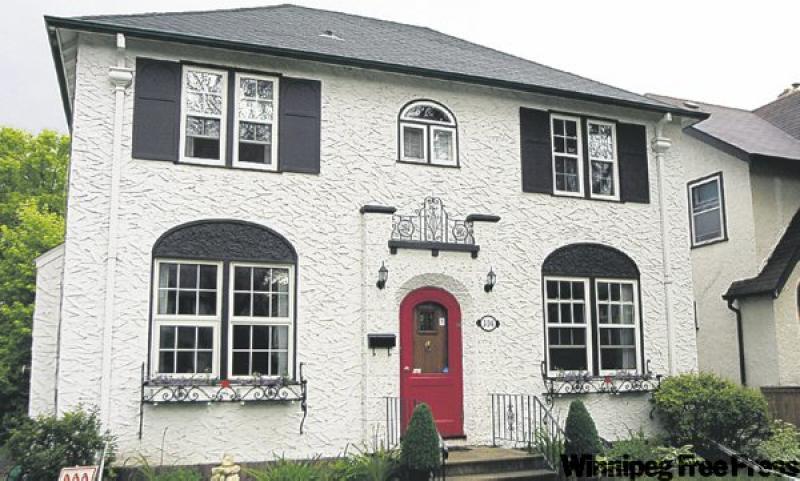 304 Elm Stret started life as one of the city's first show homes. Today's owners have retained its sharacter while adding touches of whimsy.
