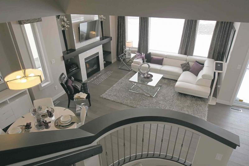 The view from upstairs. Highlights include a gas fireplace, built-in cabinets and an abundance of natural light.