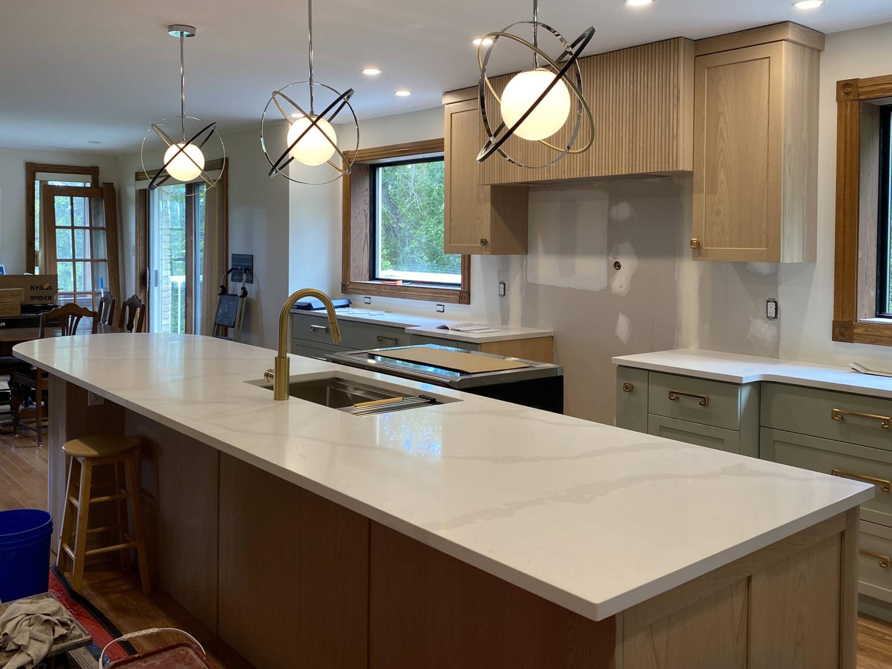  <p>The quartz countertop along the 13-foot long island exceeds a raw slab length and so is comprised of two pieces joined together via a concealed seam using epoxy. (Marc LaBossiere / Free Press)</p> 