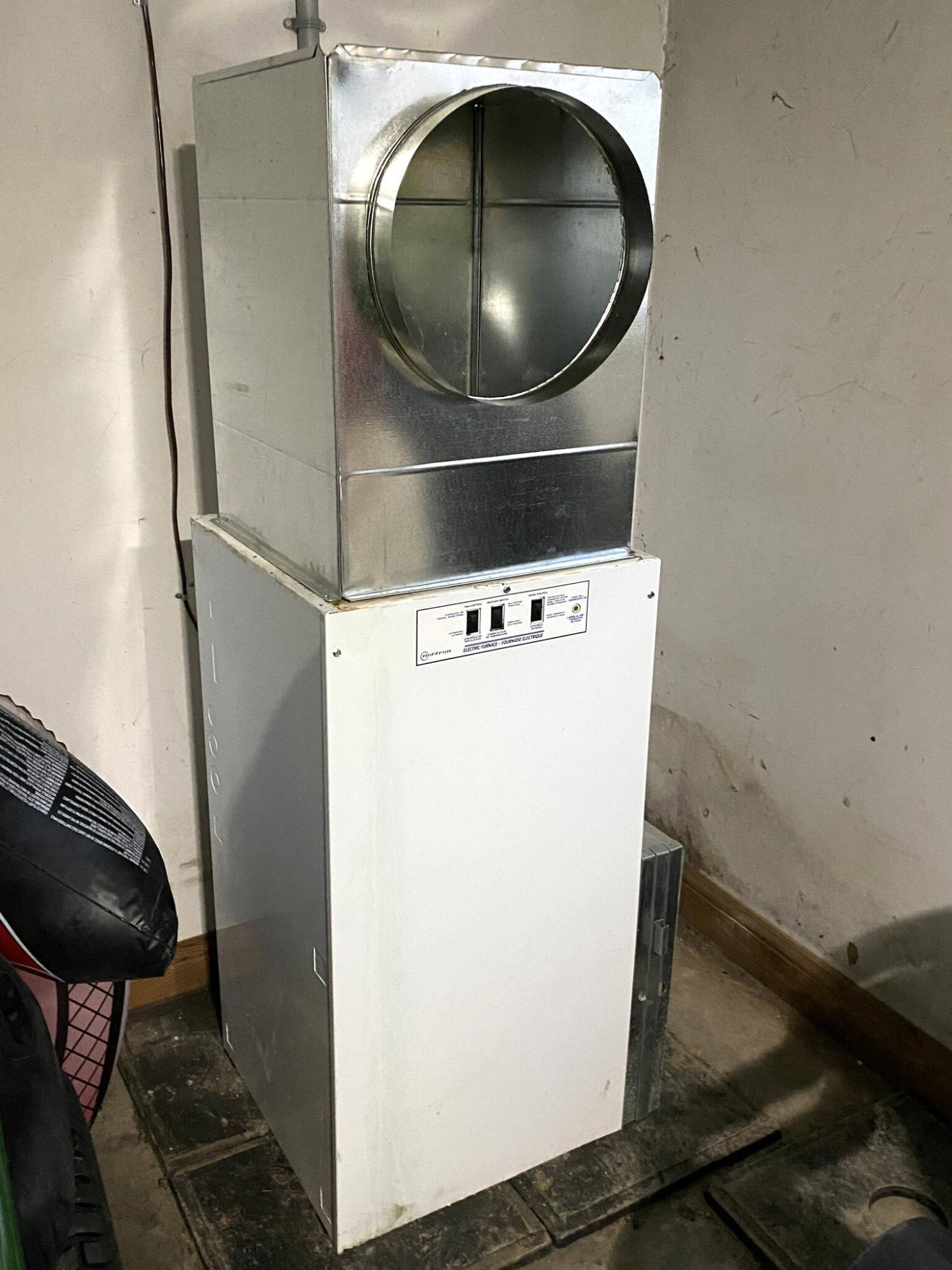  <p>Marc LaBossiere / Winnipeg Free Press</p>
                                <p>This nearly 40-year-old electric furnace found a new home in one of the garage stalls.</p> 