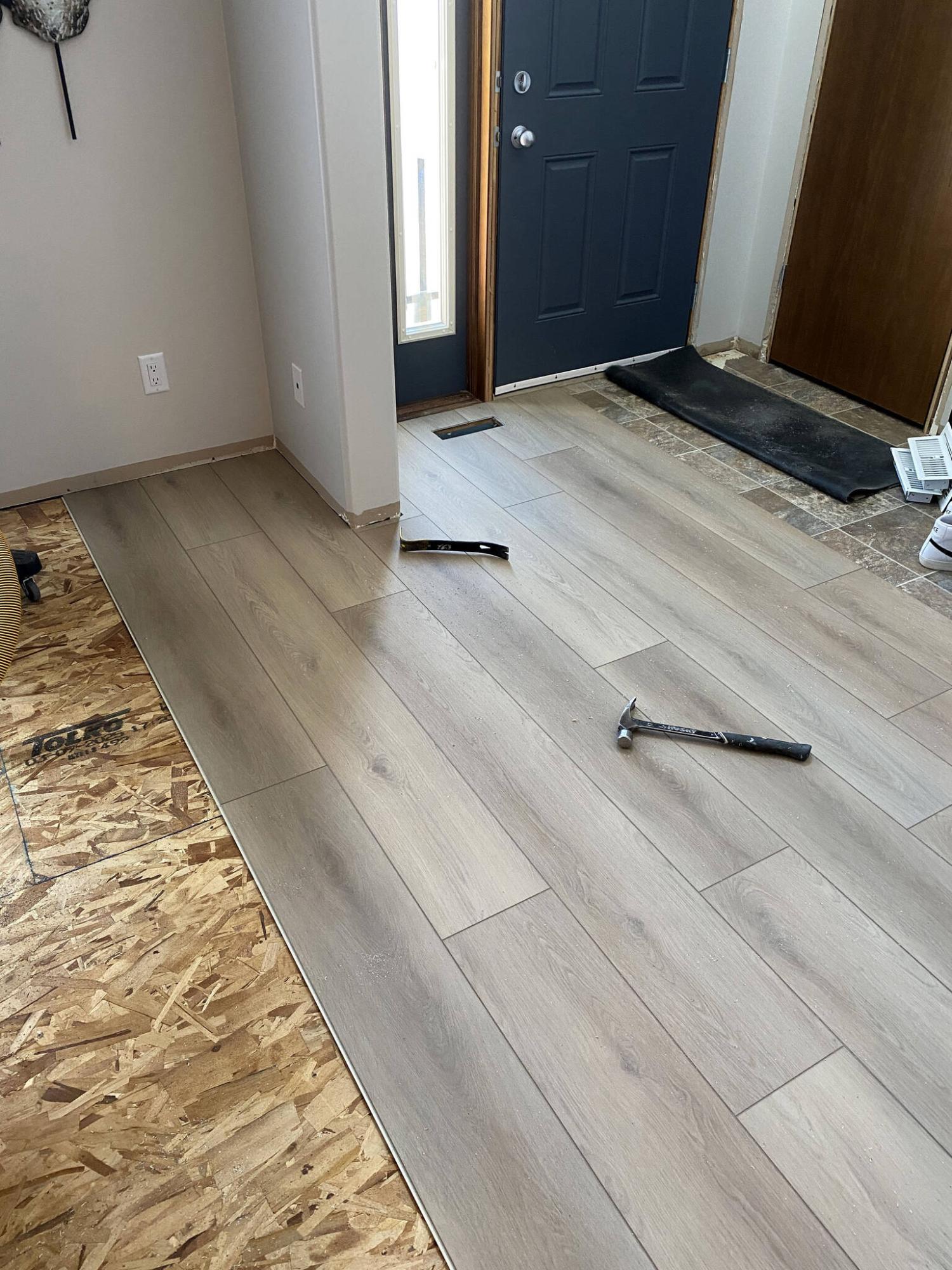  <p>MARC LABOSSIERE / FREE PRESS</p>
                                <p>Once the sub-floor elevation is made consistent, vinyl-plank installation can begin.</p> 