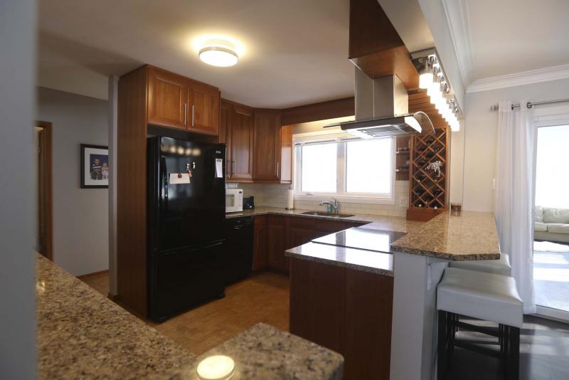 <p>RUTH BONNEVILLE / WINNIPEG FREE PRESS</p><p>This ultra-modern kitchen includes cork flooring, granite countertops and a built-in cooktop.</p></p>