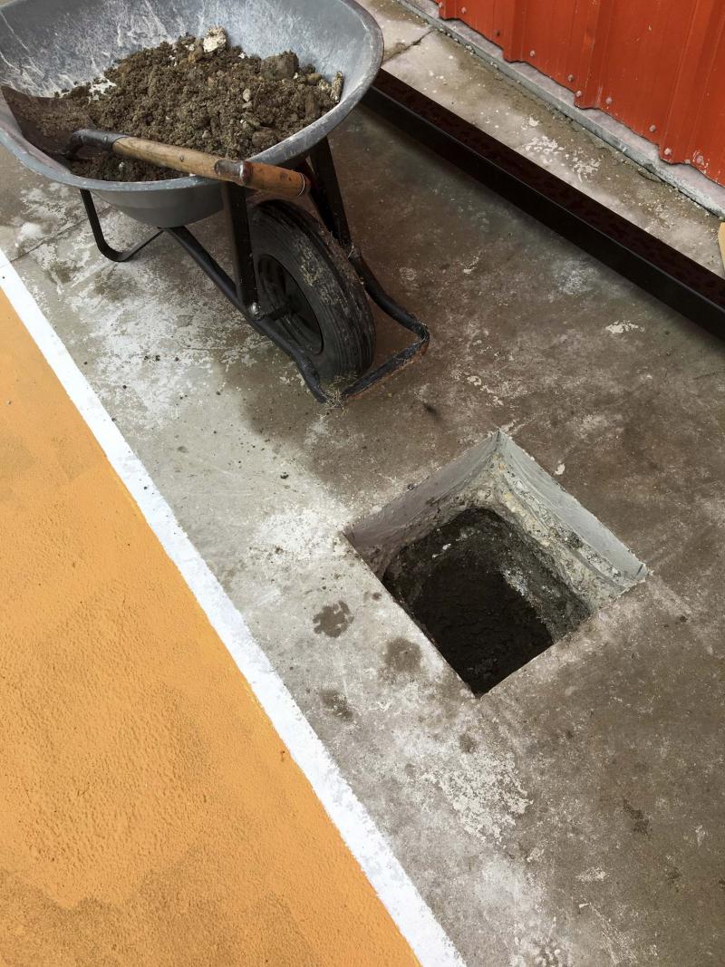 <p>Marc Labossiere / Winnipeg Free Press</p><p>A 16-inch-square hole was made in the existing concrete to house the new post. </p>
