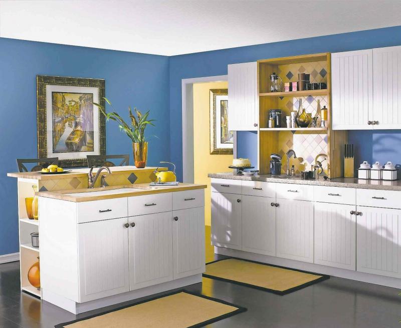 The vivid blue wall colour really brings life to this kitchen.