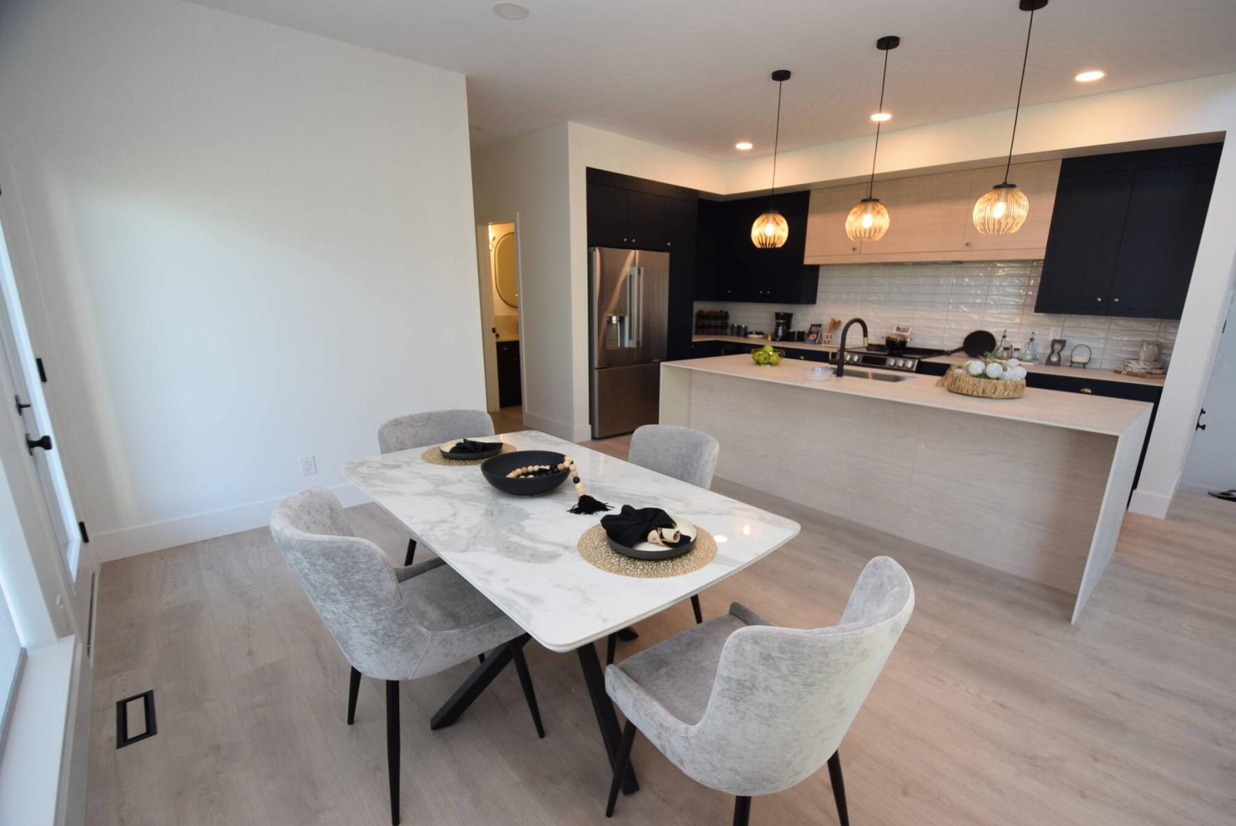  <p>Todd Lewys photos / Free Press</p>
                                <p>The kitchen and dining area at 111 Bullrush Bay has ample space for entertaining family and friends.</p> 