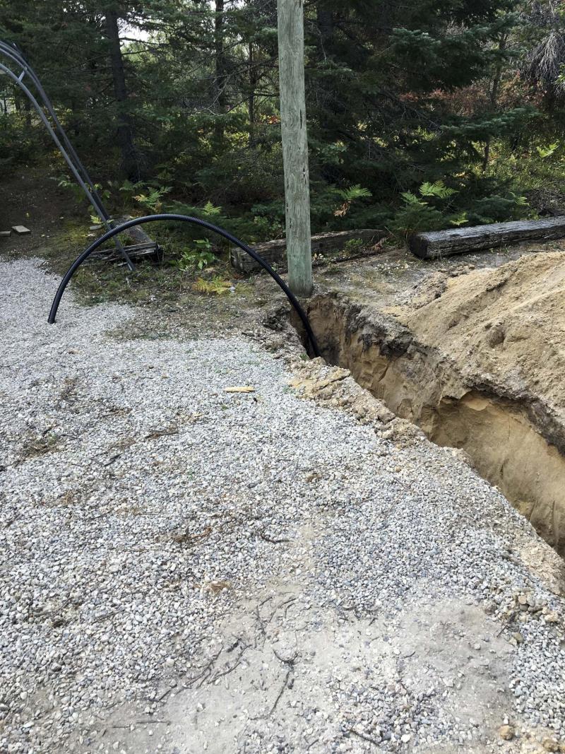 <p>The cable is placed as we go, just in case the sandy walls of the trench let go and cave in. </p>