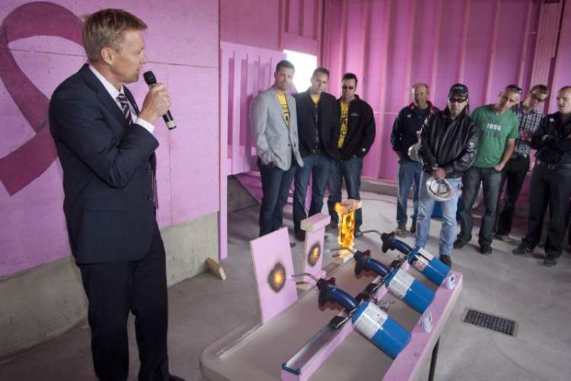 According to Blair Nutting (holding microphone), Pinkwood's vice-president of business development, the distinctive pink coating could, in time, prompt a major change in the industry.