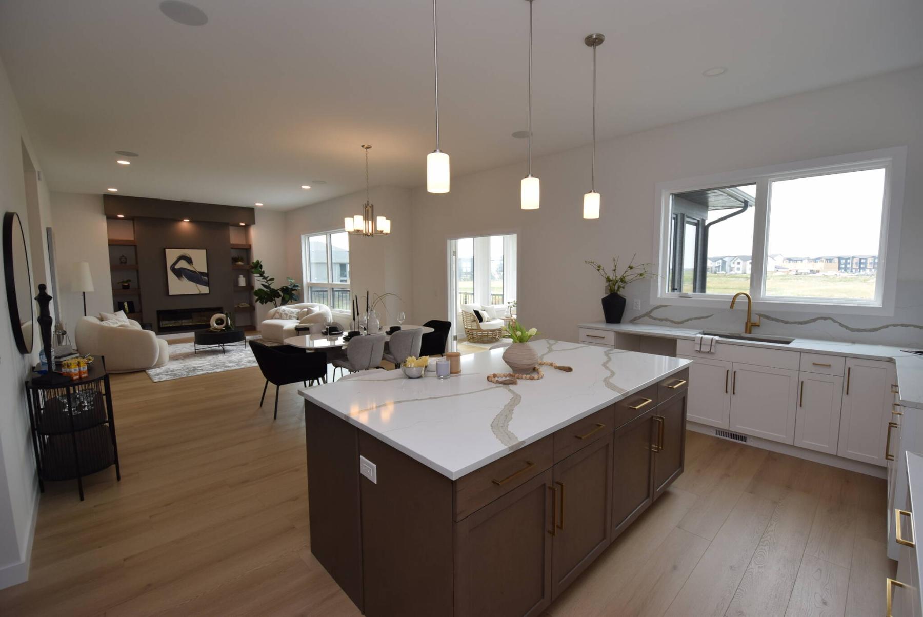  <p>TODD LEWYS / FREE PRESS</p>
                                <p>Natural light, plenty of space and luxurious finishings give the main living area at 55 Siddiqui Ridge, Bison Run, a warm and inviting ambience.</p> 