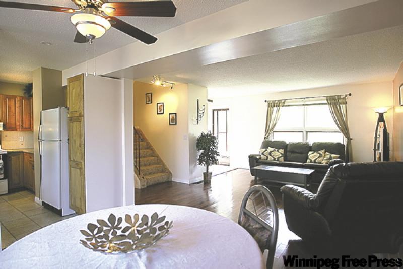 The open-concept dining room/living room area is large enough to accommodate a dining table for family gatherings -- with enough room left over to recline in front of a movie over dessert.