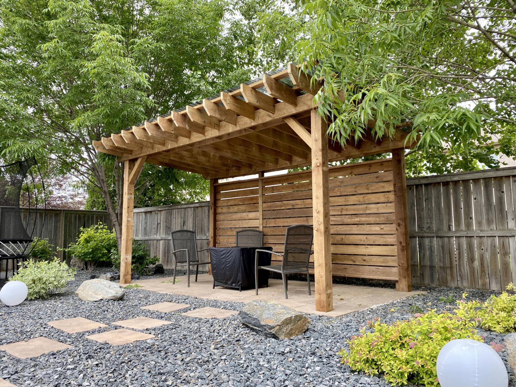 <p>Photos by Marc LaBossiere / Winnipeg Free Press</p><p>The 16-foot wide by 10-foot deep pergola is nestled within the trees at the far end of this backyard.</p>