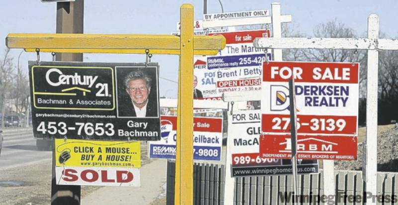 For sale signs clustered along Pembina Hwy.