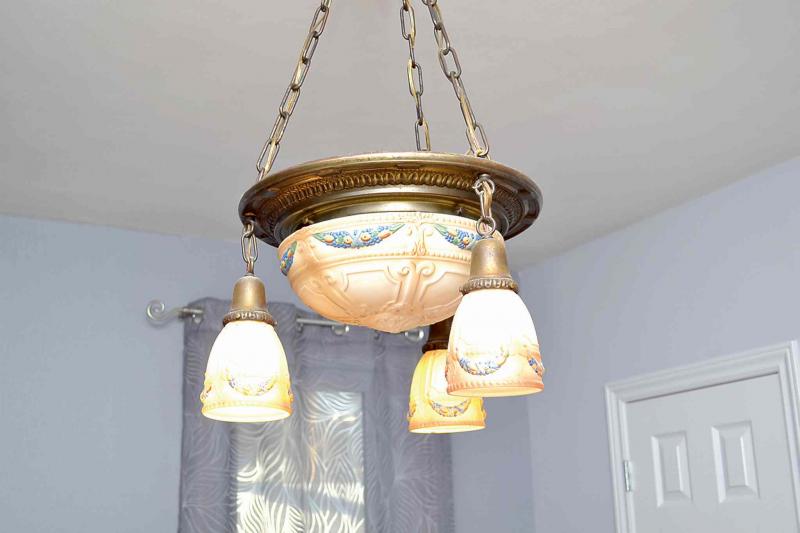 Ranick's home is an eclectic collection of traditional and contemporary furnishings. This overhead living room light belonged to her grandparents.