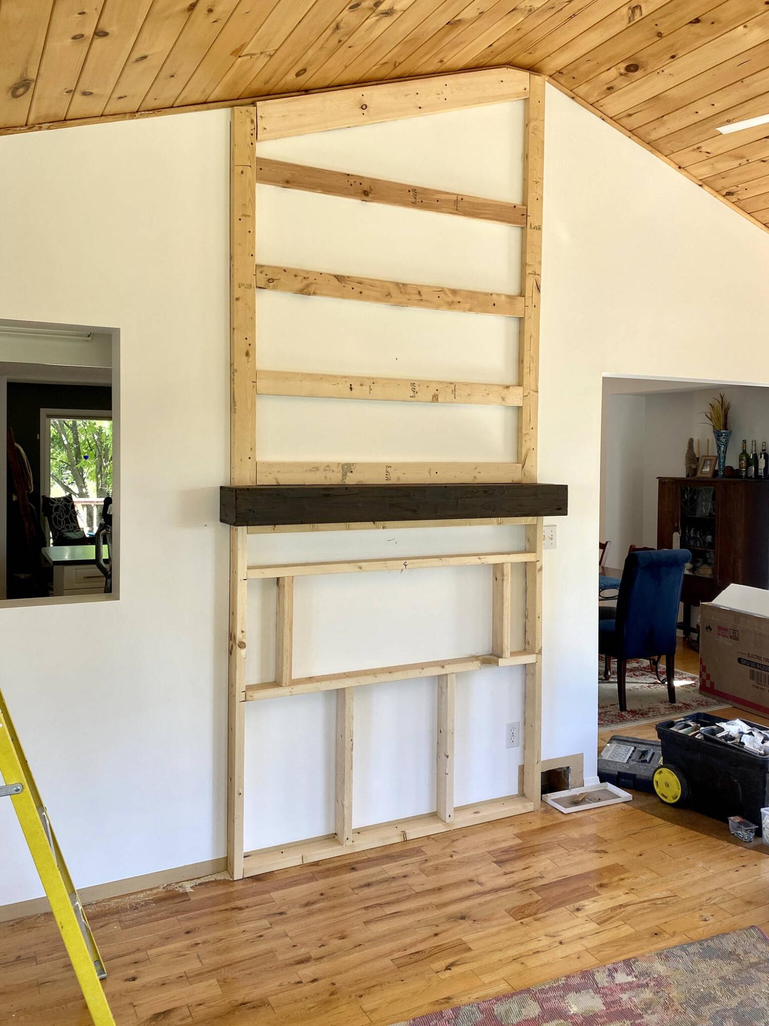 <p>The framing anchored to the wall incorporates the mantle to give it that built-in appearance.</p> 