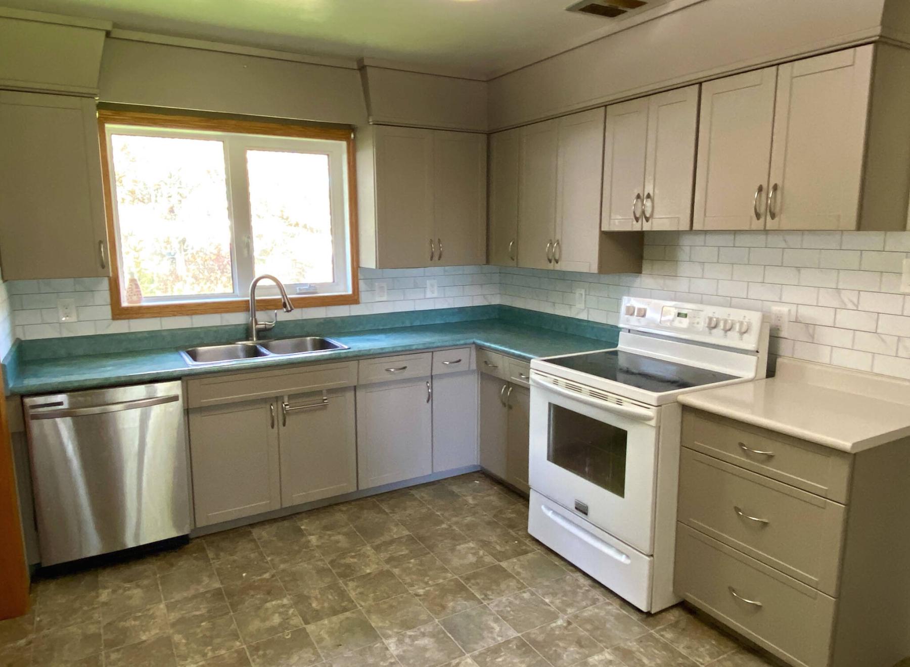  <p>Marc LaBossiere / Free Press</p>
                                <p>A new peel-and-stick backsplash greatly improves a rental-property kitchen while adhering to a strict budget.</p> 