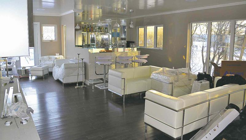 The living area of this Wellington Crescent home features beautiful Le Corbusier sofas and easy chairs.