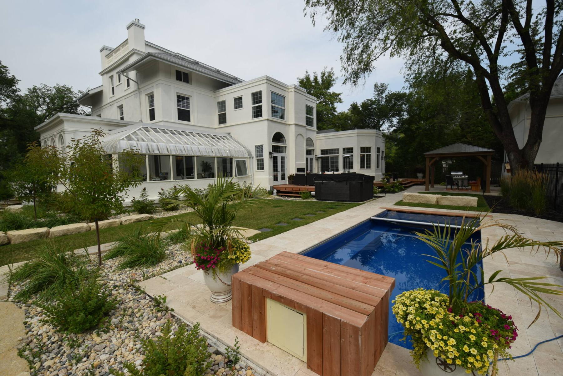  <p>Photos by Todd Lewys / Winnipeg Free Press</p>
                                <p>The backyard features a pool, hot tub, multiple sitting areas and impeccable landscaping.</p> 
