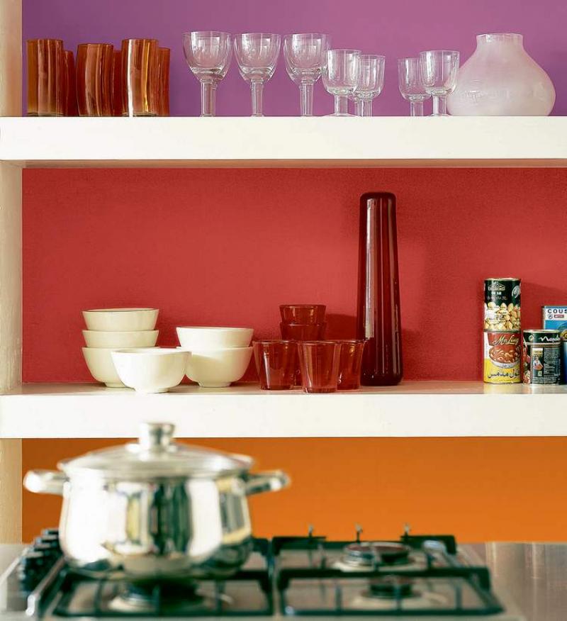 By painting the back of each shelf with a vibrant colour, suddenly this little kitchen is teeming with character. The once-plain items sitting on the shelf become attractive accessories.