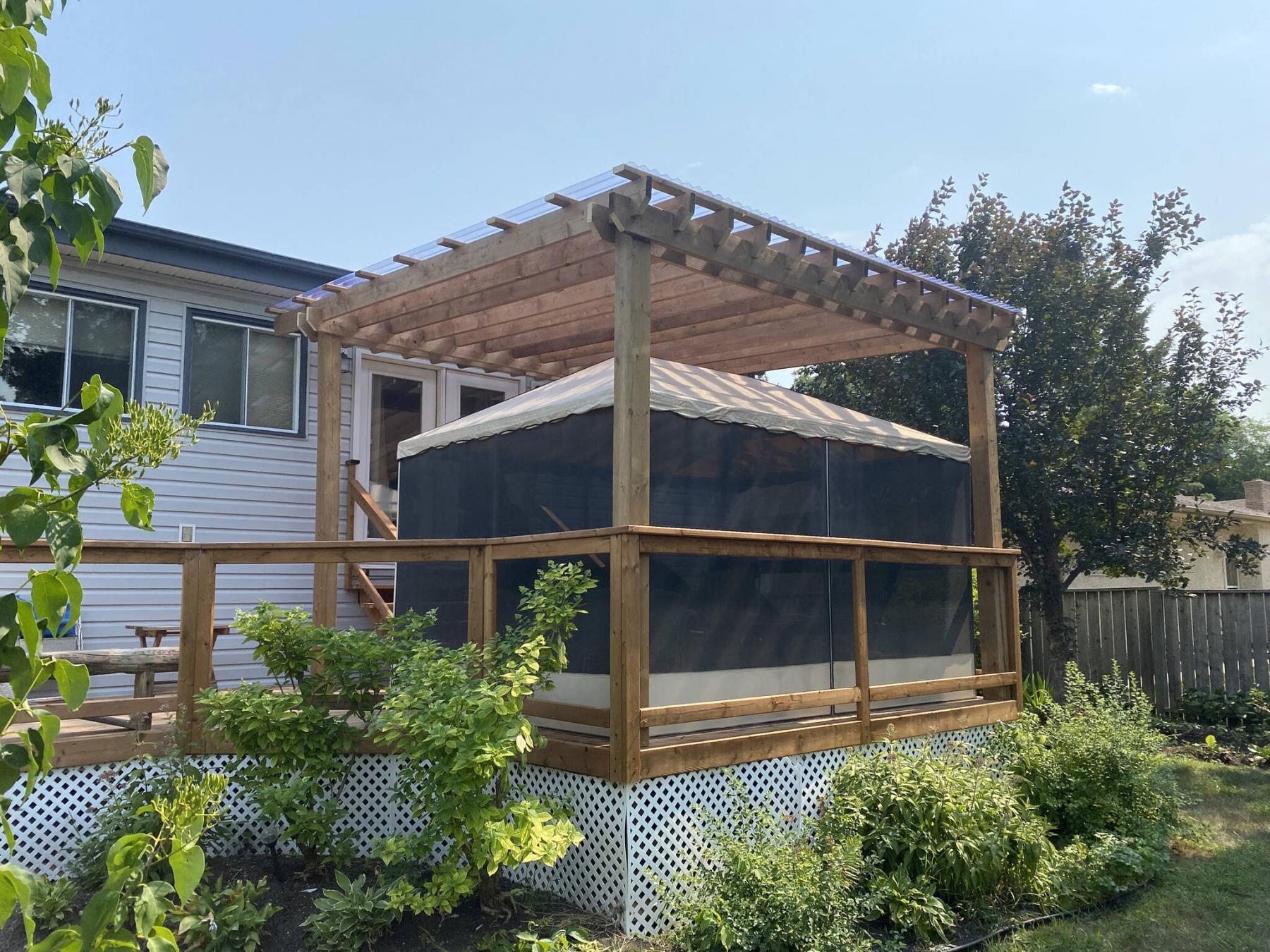 <p>Photos by Marc LaBossiere / Winnipeg Free Press Clear corrugated panels are affixed to the 2x4s atop the 2x8 veins, supported by 2x8 tandem beams mounted to 6x6 posts.</p>