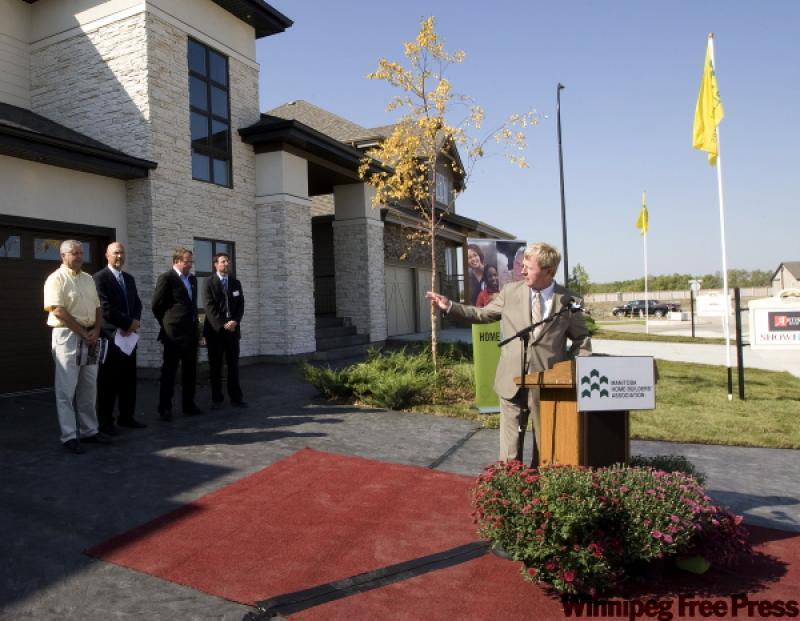 Mike Moore, president of the Manitoba Home Builders Association, introduces gues speakers at the opening of Parade of Homes in Bridgwater Forest.
