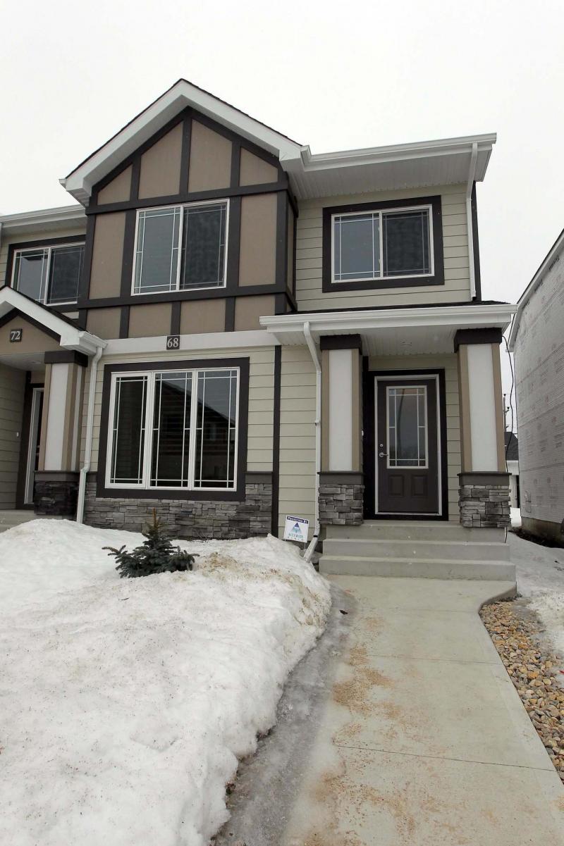 <p>BORIS MINKEVICH / WINNIPEG FREE PRESS68 Danakas Drive (The Atwood Lane Townhomes) in Transcona. Curb view. Photo taken March 09, 2016</p>