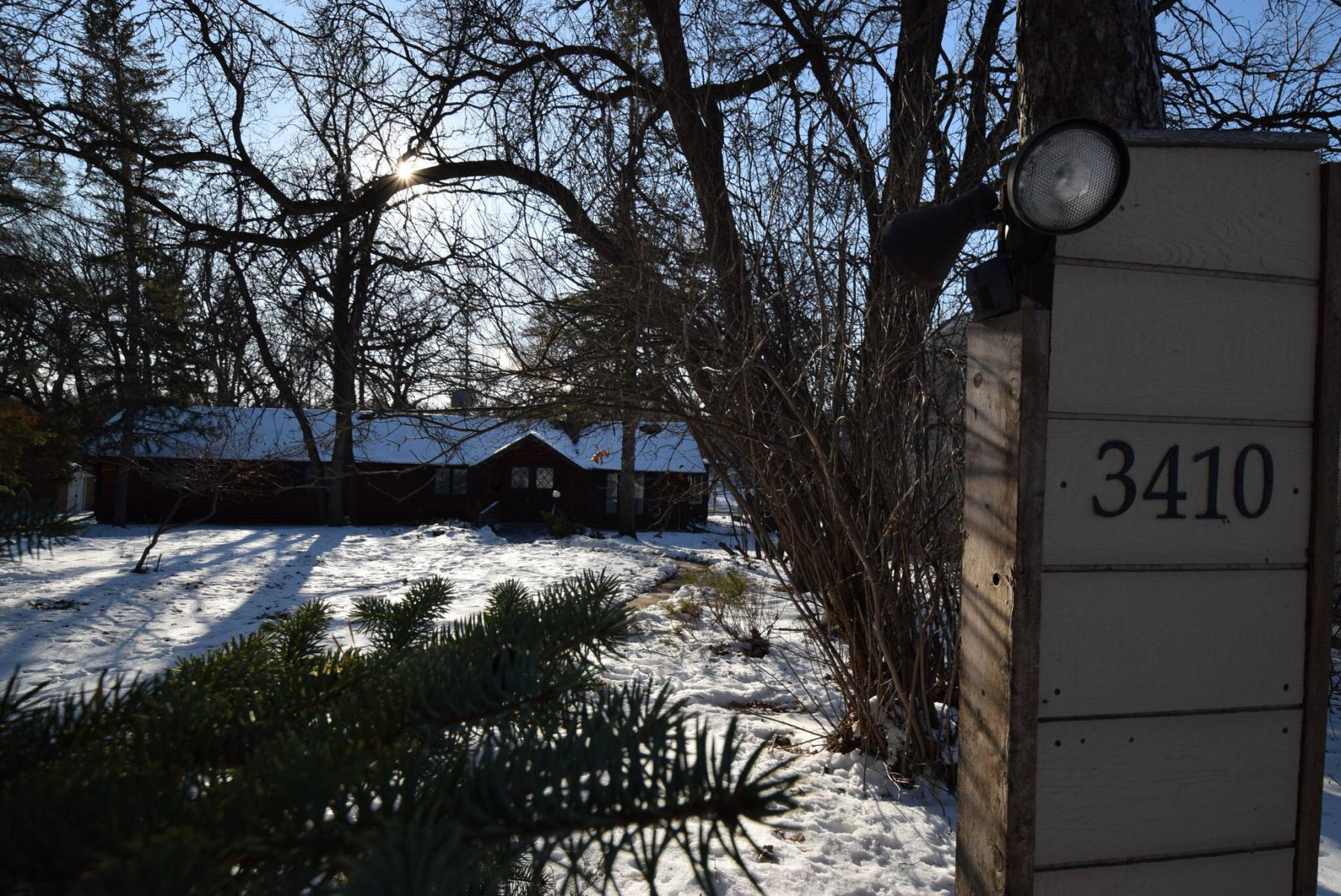 Set well back amid mature trees on a huge riverfront lot, the 1,628-sq.-ft. bungalow offers a cottage-like feel in a quiet spot just minutes from all amenities on Portage Avenue. (Todd Lewys / Winnipeg Free Press)