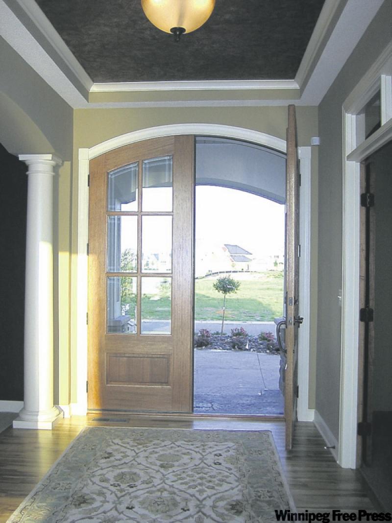 Mahogany doors are beautiful, but once cracked require careful application of the proper wood filler to restore.
