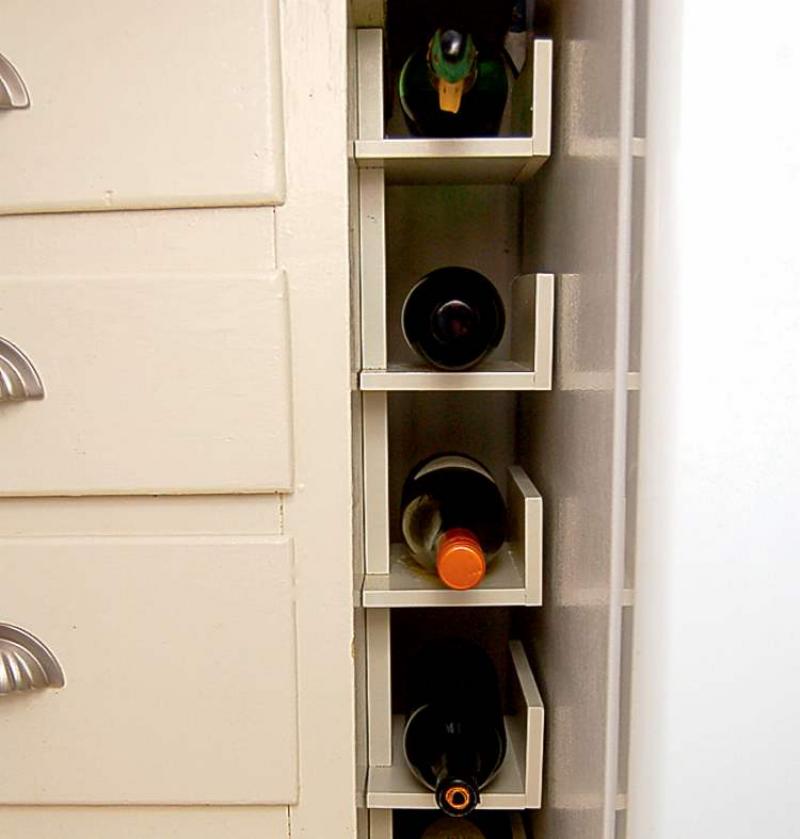 A prefabricated shelf was slightly altered and repainted to create this handy wine rack.