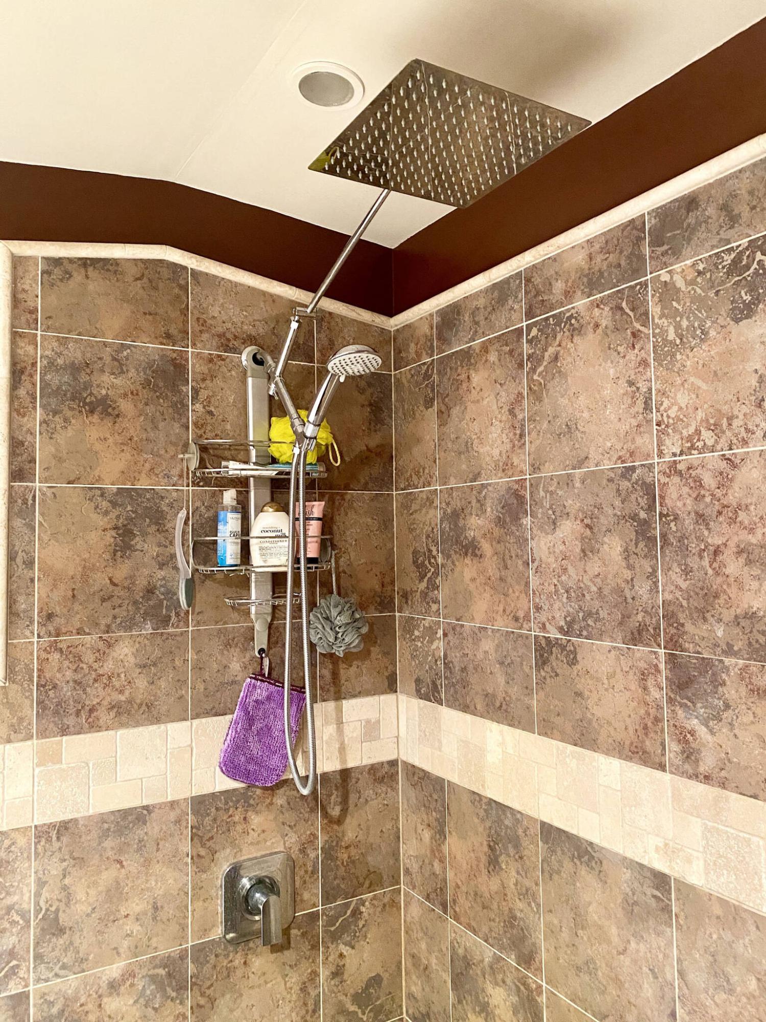  <p>Marc LaBossiere / Free Press</p>
                                <p>The old shower head is replaced by a double-head array, made up of elements sourced individually.</p> 