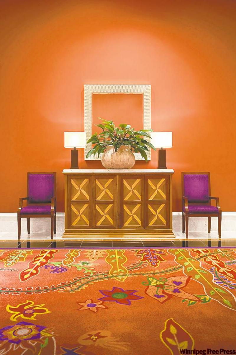 Bring the exotic influences of China into your home with a rich palette of reds, oranges, purples and greens, such as this room featuring CILâs Oriental Poppy orange, Amazing red, Jade Valley green and Palace Purple.