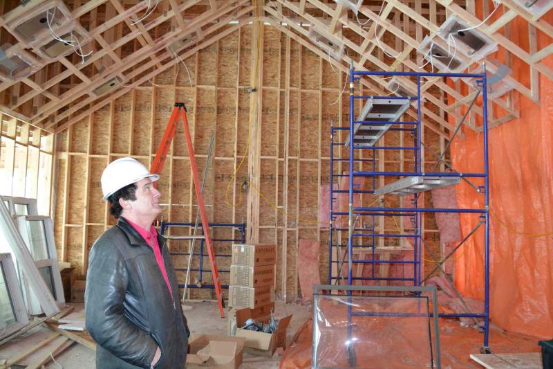 Larry Larwyn inspects renovation featuring cathedral ceiling as of late February.