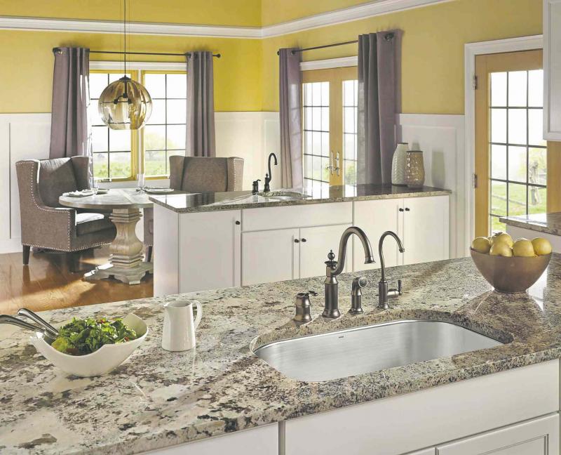 MOEN
By dividing the wall treatment into two elements, wainscoting can make a room seem larger.