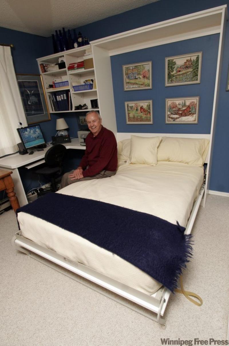 Home offices that do double duty make the most out of your home's rooms. Here, a Murphy bed integrates into the desk and wall unit to transform the office into a guest room at the drop of a bed.
