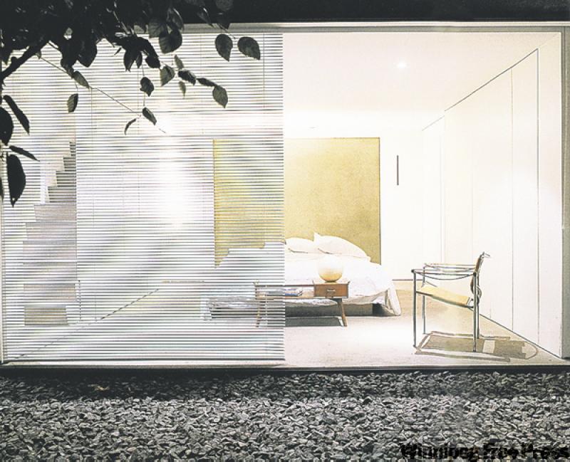 This bedroom is short on clutter and long on style, but it also has good feng shui with a solid headboard and equal bedside spaces.