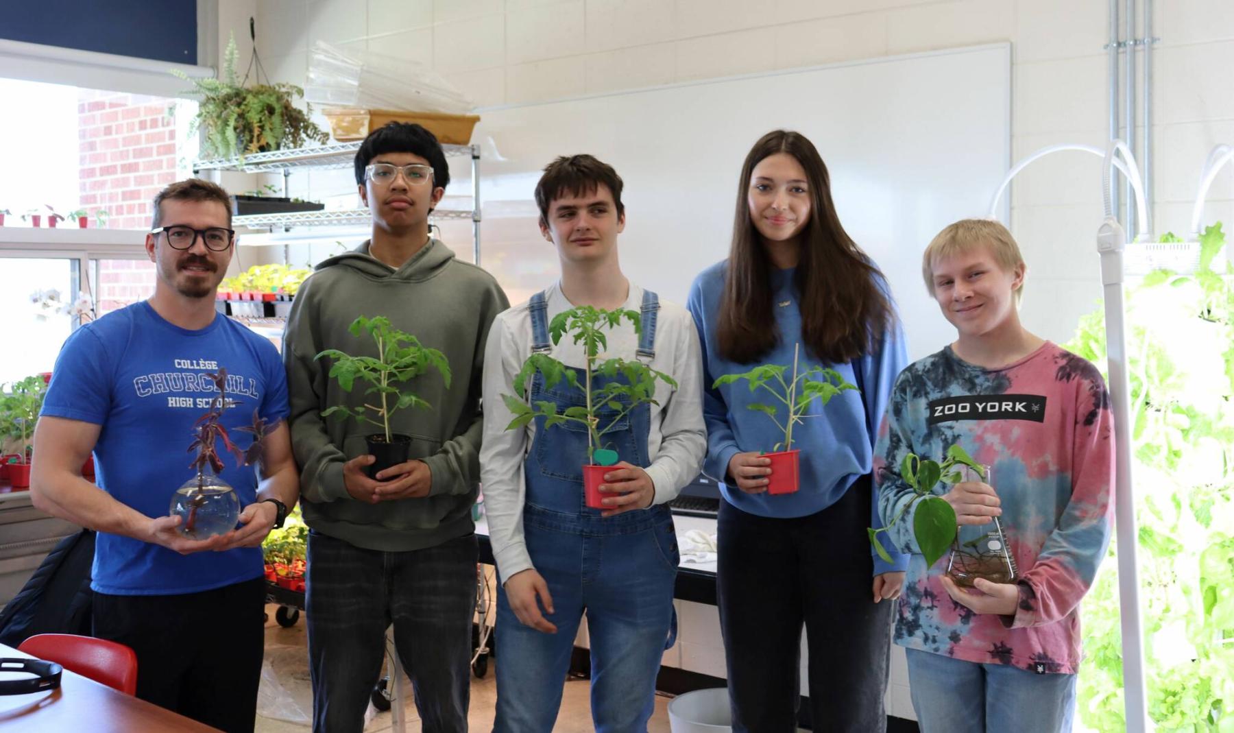  <p>Colleen Zacharias photo</p>
                                <p>(From left) Horticultural science teacher Dylan Rasmussen and students Rylan Peape, Jim Spreitzer, Danica Chaske and Jordan Neil are enjoying exploring the connections between horticulture and food security.</p> 