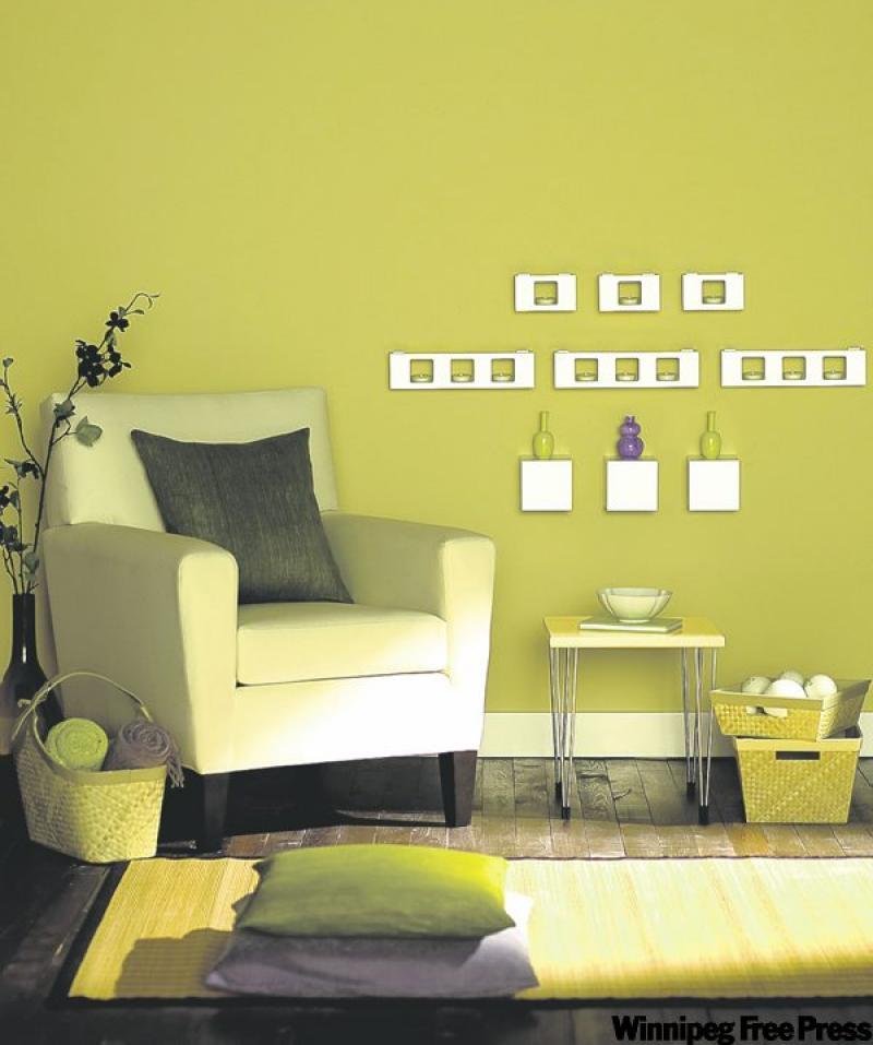 This simple vignette makes a good start for an inviting, airy space. It features a natural palette of golden brown walls, a neutral area rug and a well-planned wall display.
